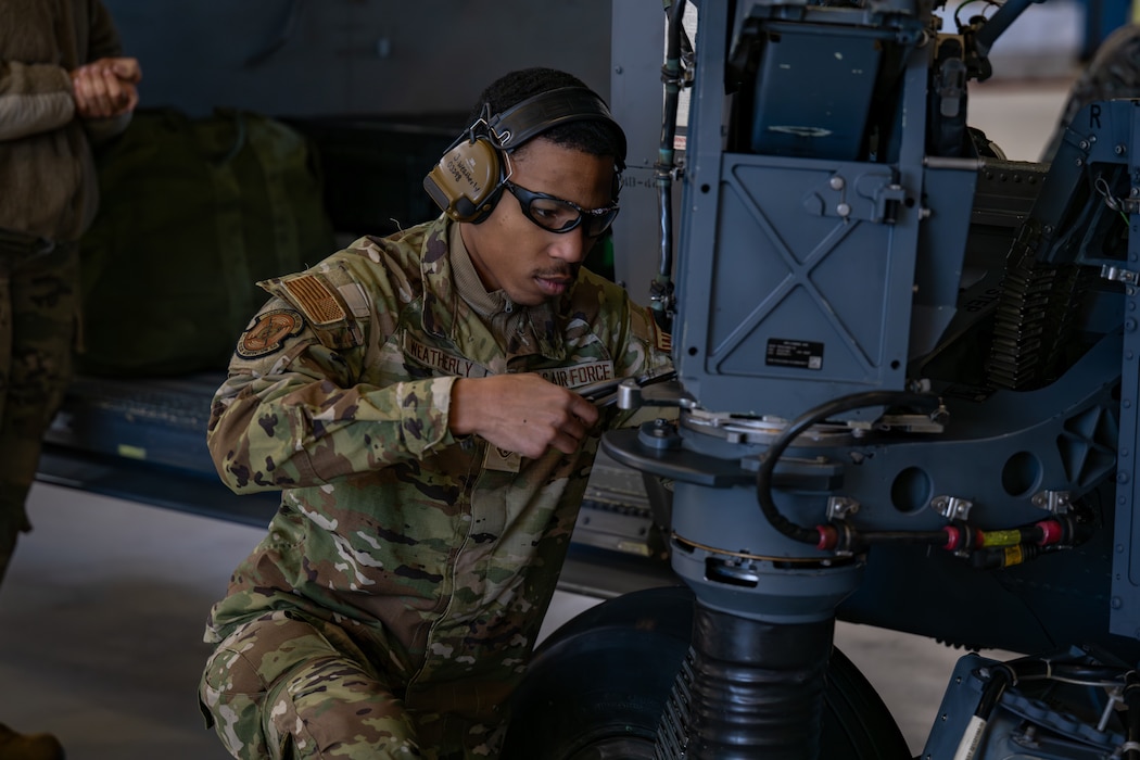 Man works on machinery.