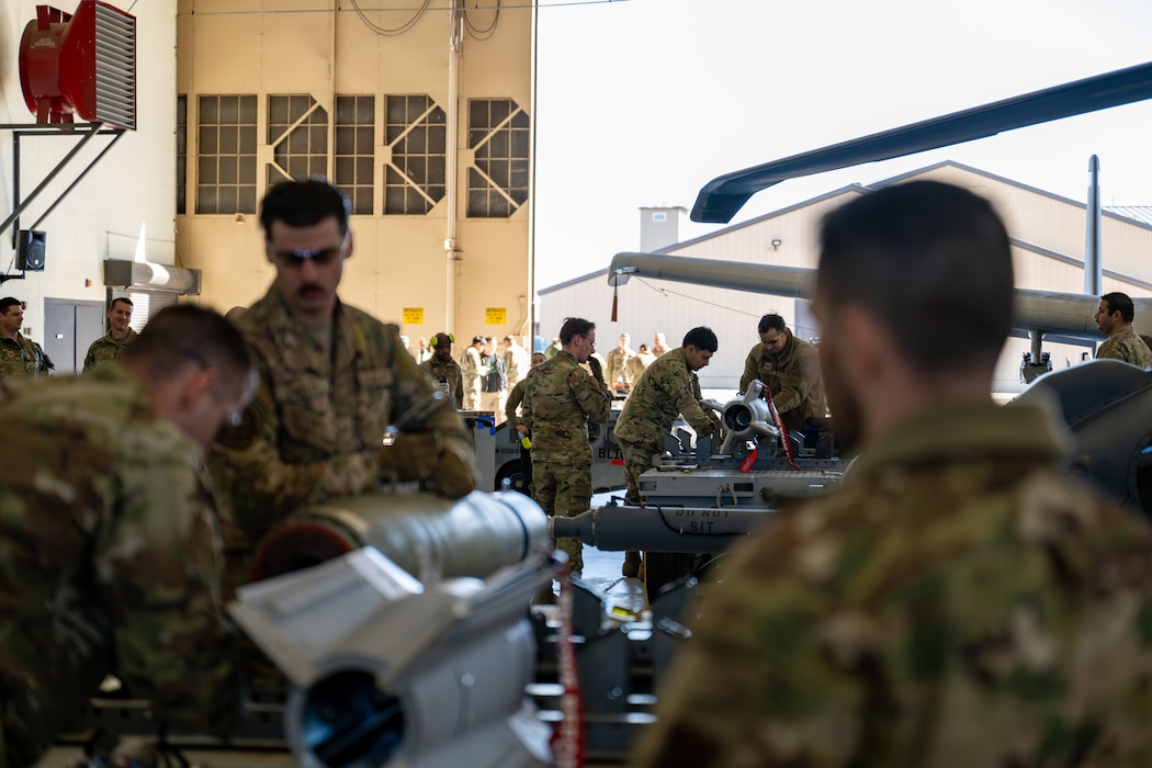 People work on machinery.