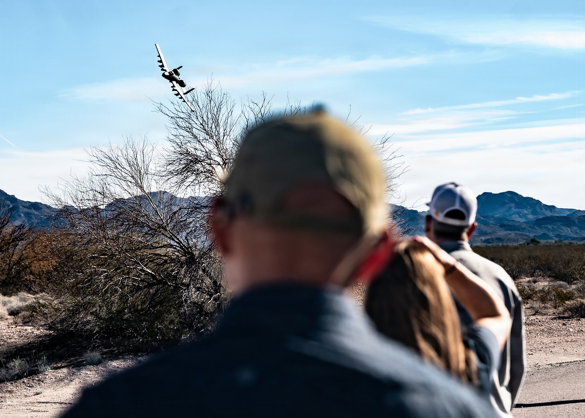 An A-10 Thunderbolt II assigned to the 355th Wing, Davis-Monthan Air Force Base, performs a flight demonstration for 56th Fighter Wing honorary commanders during a simulated deployment, Jan. 22, 2026, at Barry M. Goldwater Range, Arizona. Directly observing the coordination between air assets and range personnel provided civic leaders with a practical understanding of the training environment required to maintain combat readiness. Integrating these partners into the mission environment built the mutual trust and community support necessary to sustain long-term flight operations. (U.S. Air Force photo by Airman 1st Class Belinda Guachun-Chichay)