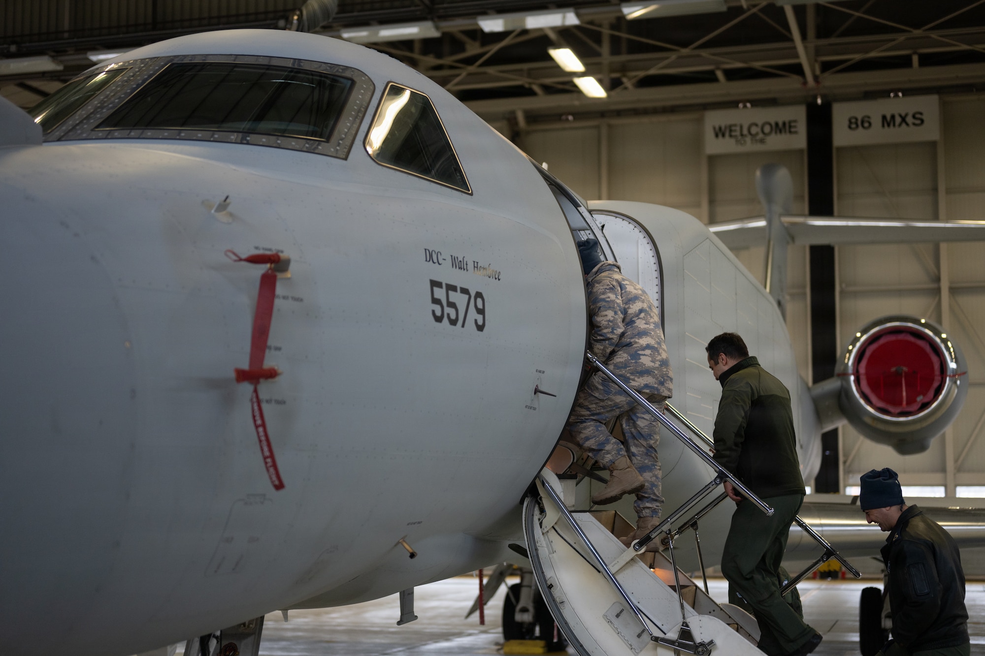 Turkish Air Force Airmen receive a tour of a U.S. Air Force EA-37B Compass Call aircraft, assigned to the 55th Electronic Combat Group, Davis-Monthan Air Force Base, Arizona, at Ramstein Air Base, Germany, Jan. 26, 2026. The aircraft is also slated to visit Spangdahlem AB, Germany, and RAF Mildenhall, England, marking the platform’s introduction to Airmen, units and NATO Allies in the U.S. Air Forces in Europe area of responsibility. (U.S. Air Force photo by Senior Airman Edgar Grimaldo)