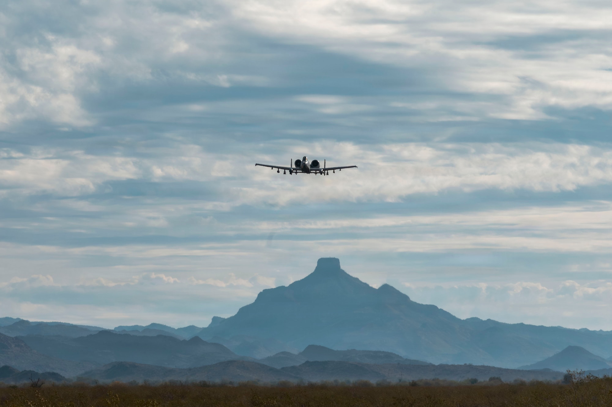 A U.S. Air Force A-10C Thunderbolt II aircraft assigned to the 357th Fighter Generation, flies over a training range in Gila Bend, Arizona, Jan. 23, 2025. The training focused on low-altitude attack techniques essential to the A-10 mission set. (U.S. Air Force photo by Airman 1st Class Samantha Melecio)