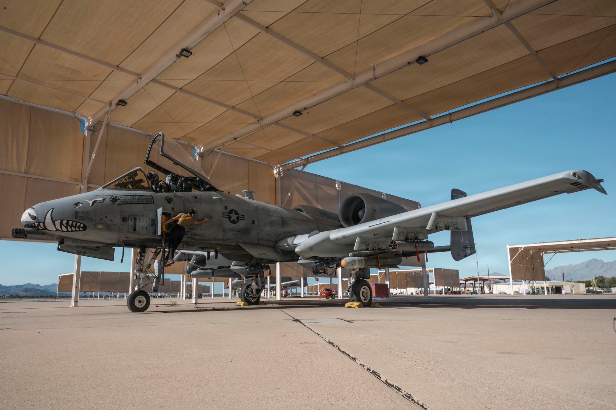 A U.S. Air Force crew chief assigned to the 357th Fighter Generation Squadron conducts pre-flight inspections on an A-10C Thunderbolt II aircraft at Davis-Monthan Air Force Base, Arizona, Jan. 13, 2026. Crew chiefs play a vital role in sustaining aircraft readiness through detailed inspections and adherence to maintenance standards. (U.S. Air Force photo by Airman 1st Class Samantha Melecio)