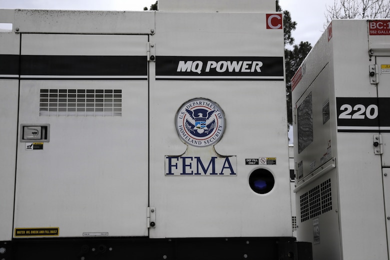 A FEMA generator sits in a staging area ready for use should it be needed to provide temporary emergency power.