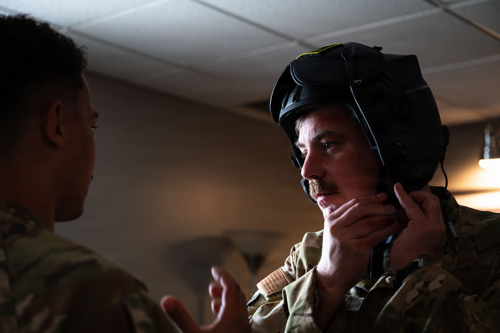 U.S. Air Force Col. Charles Redmond, 355th Wing deputy commander, is fitted for a helmet prior to an OA-1K Skyraider II aircraft familiarization flight at Davis-Monthan Air Force Base, Arizona, Jan. 21, 2026. The 492nd Special Operations Wing showcased the Skyraider II and its capabilities to 355th Wing leadership in preparation for the aircraft’s assignment to DM with the 492nd SOW. (U.S. Air Force photo by Senior Airman Jasmyne Bridgers-Matos)
