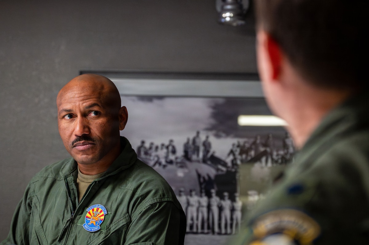 U.S. Air Force Chief Master Sgt. Kelvin Hatcher, 355th Wing command chief, receives a pre-flight briefing about the OA-1K Skyraider II prior to a familiarization flight at Davis-Monthan Air Force Base, Arizona, Jan. 21, 2026. The briefing enhanced mission readiness by ensuring all aircrew were synchronized and prepared for safe and effective operations prior to flight. (U.S. Air Force photo by Senior Airman Jasmyne Bridgers-Matos)