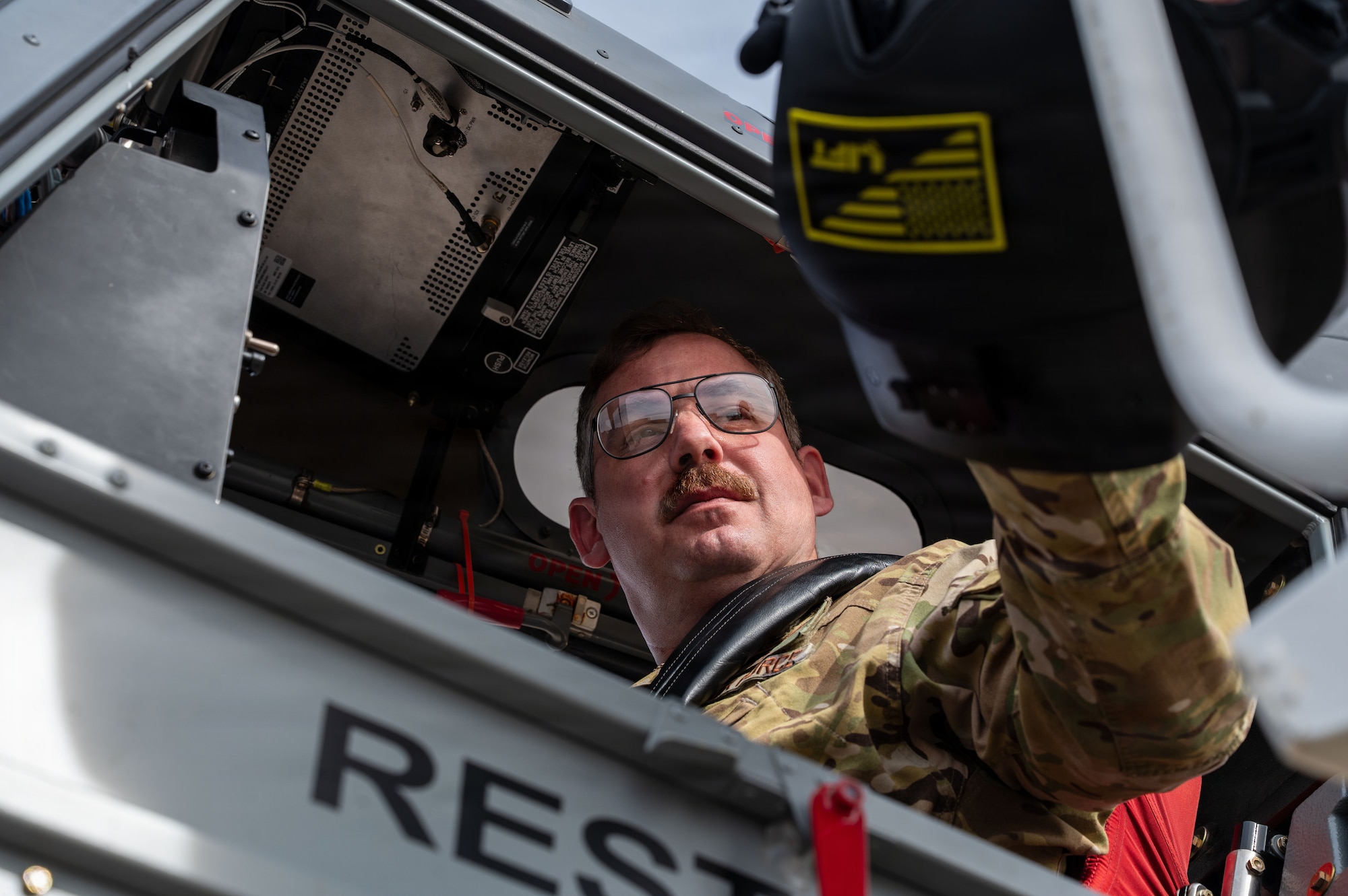 U.S. Air Force Col. Charles Redmond, 355th Wing deputy commander, grabs a helmet prior to takeoff in an OA-1K Skyraider II aircraft assigned to the 492nd Special Operations Wing at Davis-Monthan Air Force Base, Arizona, Jan. 21, 2026. 355th Wing leadership familiarized themselves with one of the new assets coming to DM in order to lead from the front and ensure Airmen across the base are mission ready on any platform. (U.S. Air Force photo by Senior Airman Jasmyne Bridgers-Matos)