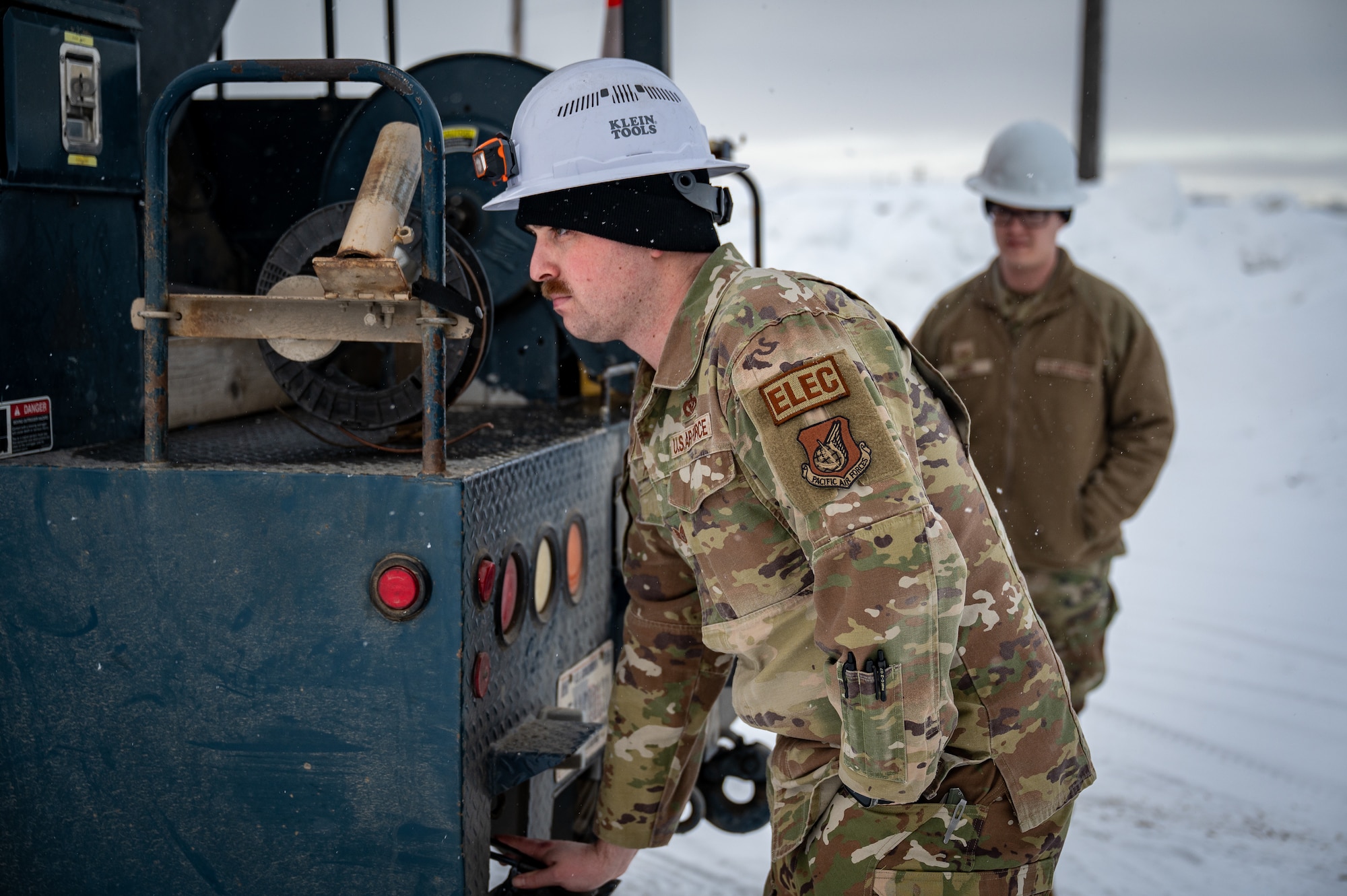 U.S. Air Force Staff Sgt. Austin Frerichs, 773d Civil Engineer Squadron electrical systems craftsman, operates a utility truck at Joint Base Elmendorf-Richardson, Alaska, Jan. 26, 2026. The work supports base readiness by keeping critical infrastructure and power systems operational during severe winter weather. (U.S. Air Force photo by Senior Airman Hunter Hites)