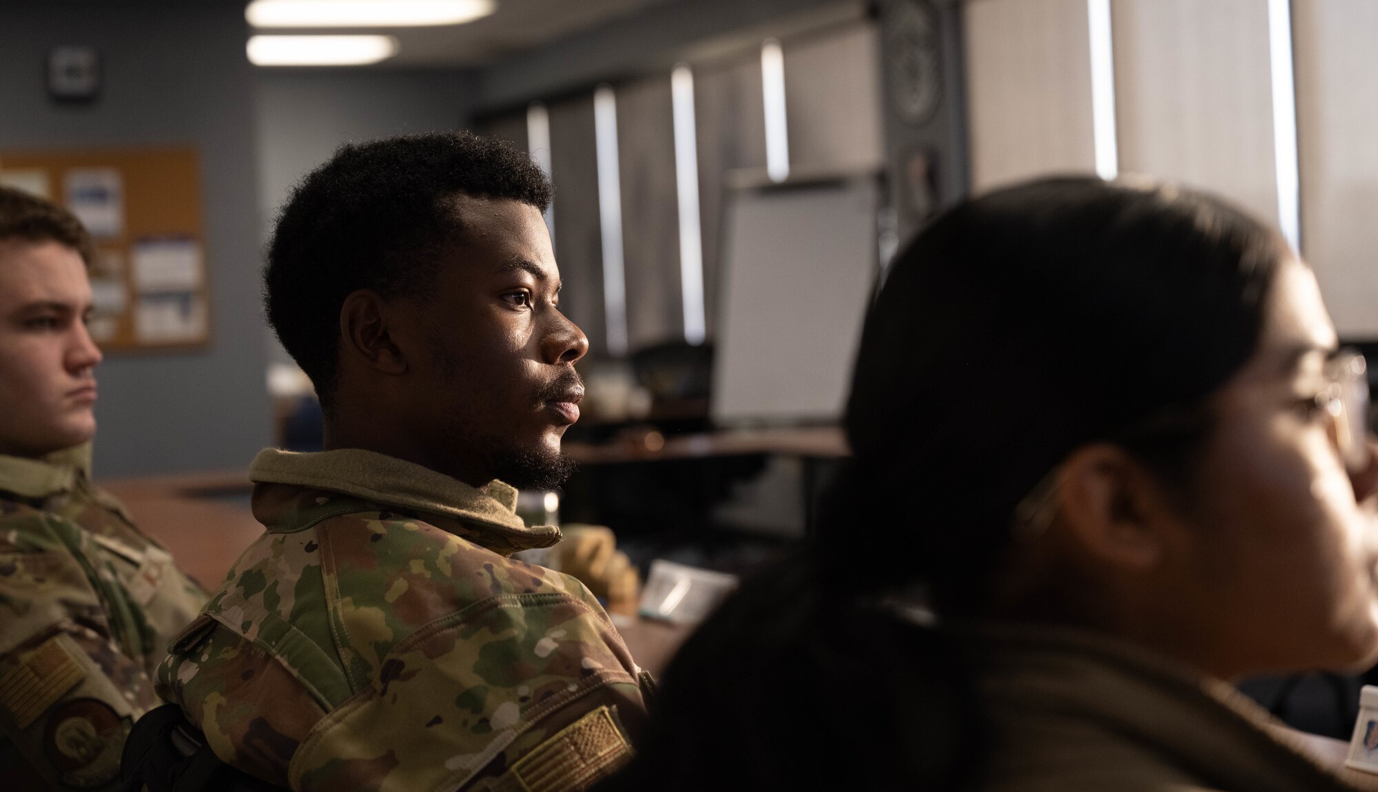 U.S. Air Force Airman Divin Mulumba, 97th Operations Support Squadron aircrew flight equipment technician, stays engaged during the First Term Enlisted Course (FTEC) at Altus Air Force Base, Oklahoma, Jan. 12, 2026. Mulumba participated in team-building activities, physical training sessions, briefings and a KC-46 Pegasus flight as a part of the FTEC curriculum. (U.S. Air Force photo by Airman 1st Class Emma Wright)