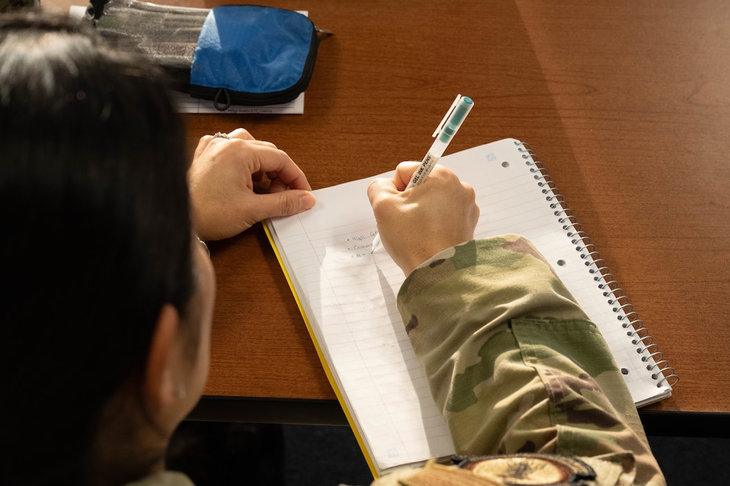 U.S. Air Force Airman 1st Class Kozora Madoka, Altus Medical Group mental health technician, takes notes during the First Term Enlisted Course (FTEC) at Altus Air Force Base, Oklahoma, Jan. 12, 2026. The FTEC curriculum incorporated various briefings ranging from financial literacy to resilience training. (U.S. Air Force photo by Airman 1st Class Emma Wright)