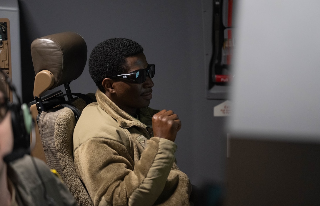 U.S. Air Force Airman 1st Class Bashiru Ahmed, 97th Logistics Readiness Squadron air operation flight apprentice, witnesses in-flight refueling on a KC-46 Pegasus at Altus Air Force Base, Oklahoma, Jan. 15, 2026. Ahmed wore 3D glasses while watching how a boom operator executes in-flight refueling as a part of his participation in the First Term Enlisted Course. (U.S. Air Force Photo by Airman 1st Class Emma Wright)