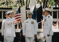 JOINT BASE PEARL HARBOR-HICKAM, Hawaii (Jan. 16, 2026) - Cmdr. Jeffrey Vandenengel, incoming commanding officer of Virginia-class fast-attack submarine USS Illinois (SSN 786), left, salutes Cmdr. Johannes Smith, outgoing commanding officer of Illinois, right, while Capt. Chris Hedrick, commodore, Submarine Squadron 1, center, observes during the Illinois’s change of command ceremony at the USS Parche Park and Submarine Memorial on Joint Base Pearl Harbor-Hickam, Hawaii, Jan. 16, 2026. Illinois is assigned to Submarine Squadron 1 and is capable of supporting various missions, including anti-submarine warfare, anti-surface ship warfare, strike warfare, special operations forces support, and intelligence, surveillance, and reconnaissance. (U.S. Navy photo by Mass Communication Specialist 2nd Class Nicholas Russell)