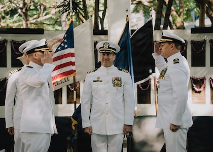 JOINT BASE PEARL HARBOR-HICKAM, Hawaii (Jan. 16, 2026) - Cmdr. Jeffrey Vandenengel, incoming commanding officer of Virginia-class fast-attack submarine USS Illinois (SSN 786), left, salutes Cmdr. Johannes Smith, outgoing commanding officer of Illinois, right, while Capt. Chris Hedrick, commodore, Submarine Squadron 1, center, observes during the Illinois’s change of command ceremony at the USS Parche Park and Submarine Memorial on Joint Base Pearl Harbor-Hickam, Hawaii, Jan. 16, 2026. Illinois is assigned to Submarine Squadron 1 and is capable of supporting various missions, including anti-submarine warfare, anti-surface ship warfare, strike warfare, special operations forces support, and intelligence, surveillance, and reconnaissance. (U.S. Navy photo by Mass Communication Specialist 2nd Class Nicholas Russell)