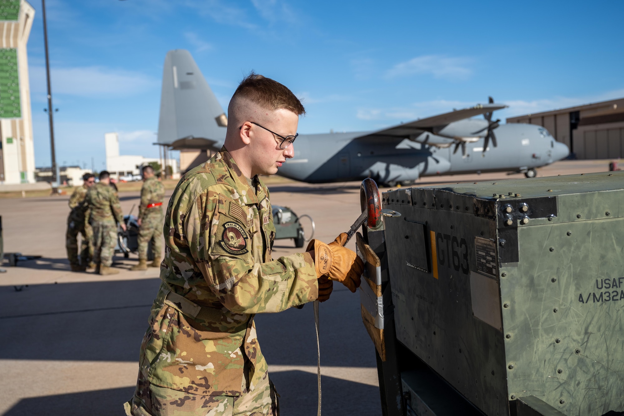 U.S. Air Force Senior Airman Bruce Christensen, 39th Airlift Squadron loadmaster, secures a steering yoke for an aircart in preparation for a Maximum Endurance Operation at Dyess Air Force Base, Texas, Jan. 12, 2026. The mission marked the 317th Airlift Wing’s 10th MEO into the Indo-Pacific region, reducing warfighting timelines and extending tactical airlift reach. The 317th AW executed the MEO en-route to participate in Exercise Palmetto Reach. (U.S. Air Force photo by Airman 1st Class Adrien Tran)