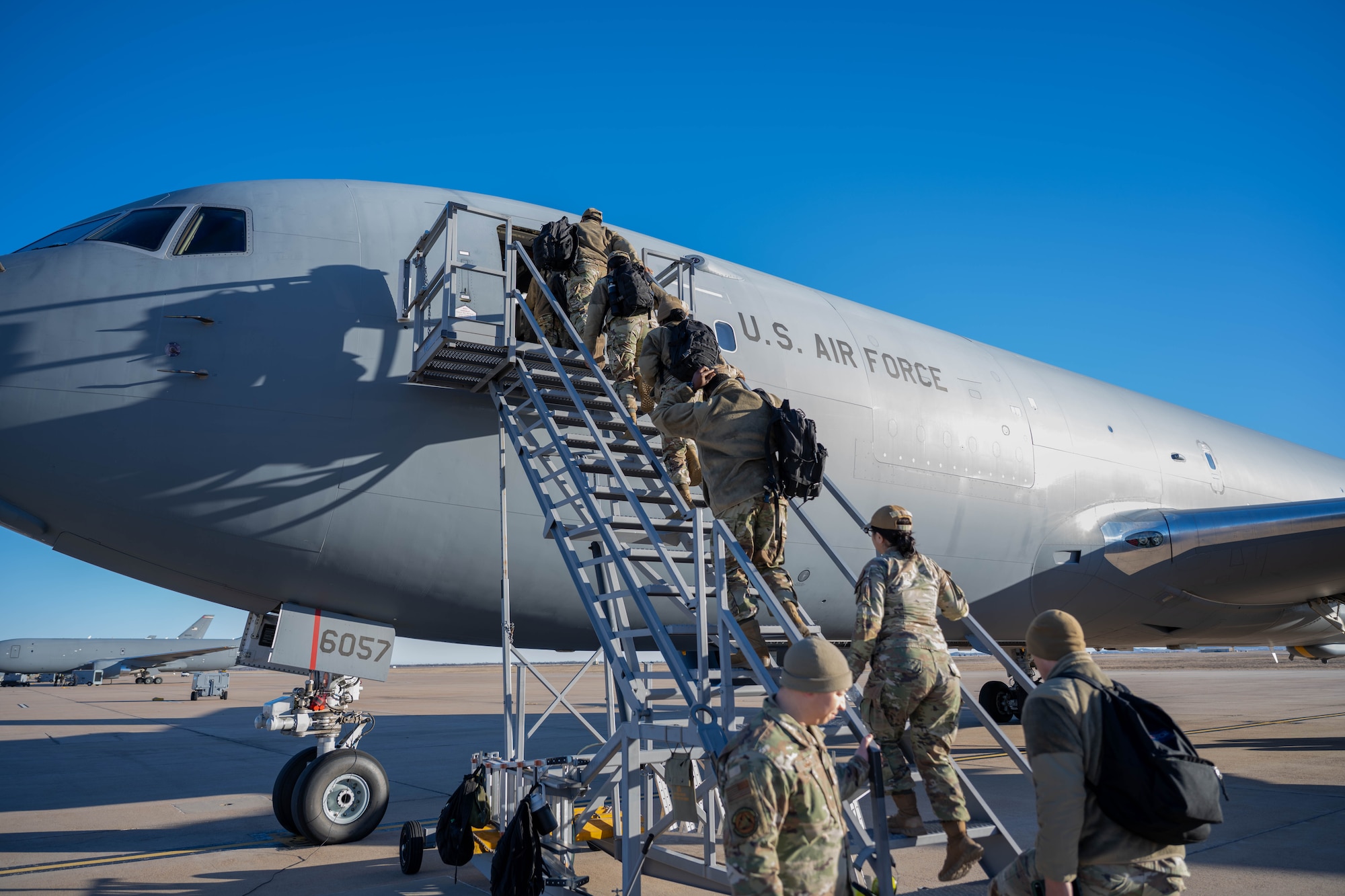 First Term Enlisted Course (FTEC) participants board a KC-46 Pegasus at Altus Air Force Base, Oklahoma, Jan. 15, 2026. Participants in FTEC took part in a KC-46 Pegasus flight in which they witnessed in-flight refueling. (U.S. Air Force Photo by Airman 1st Class Emma Wright)