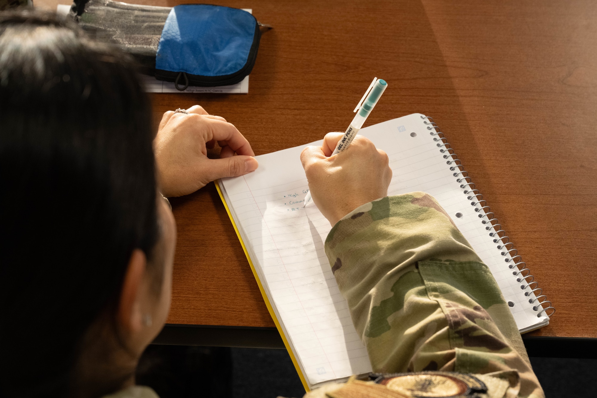 U.S. Air Force Airman 1st Class Kozora Madoka, Altus Medical Group mental health technician, takes notes during the First Term Enlisted Course (FTEC) at Altus Air Force Base, Oklahoma, Jan. 12, 2026. The FTEC curriculum incorporated various briefings ranging from financial literacy to resilience training. (U.S. Air Force photo by Airman 1st Class Emma Wright)