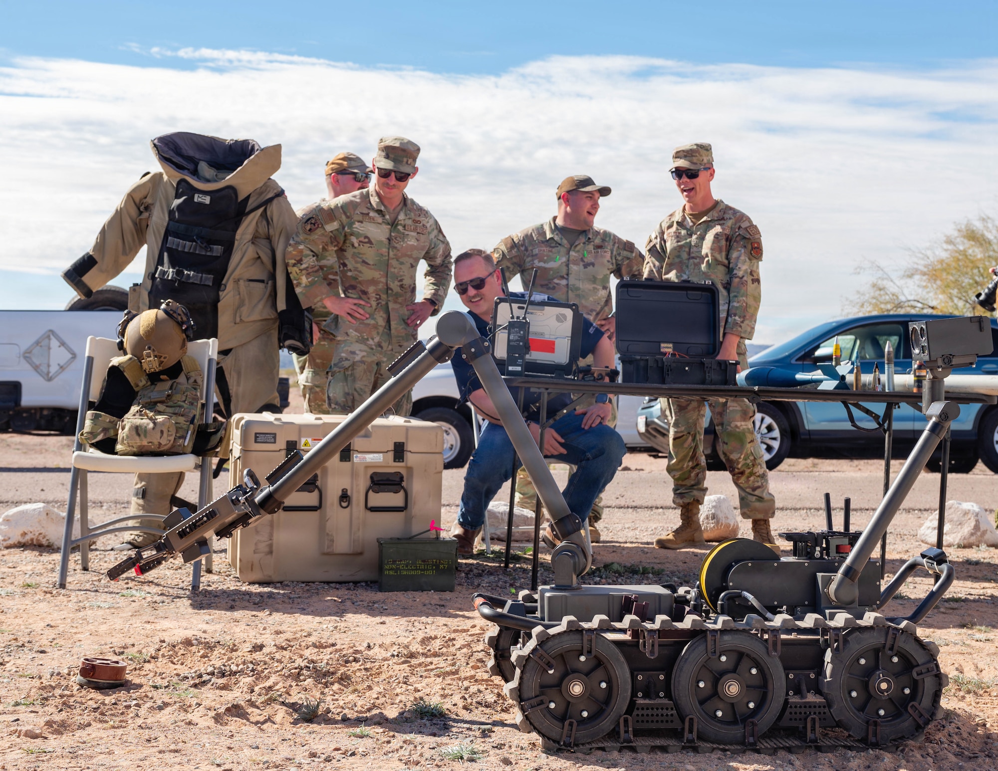 U.S. Air Force 56th Explosive Ordnance Disposal team shows a member of Fighter Country Foundation how to use a Man Transportable Robotic System, Jan. 22, 2026, at the Barry M. Goldwater Range, Arizona. Through events, sponsorships, and direct support, the Fighter Country Foundation enhances the day-to-day experience of Airmen and their families. These partnerships help create a supportive environment that extends beyond the flight line. (U.S. Air Force photo by Airman 1st Class Tekorey Watkins)