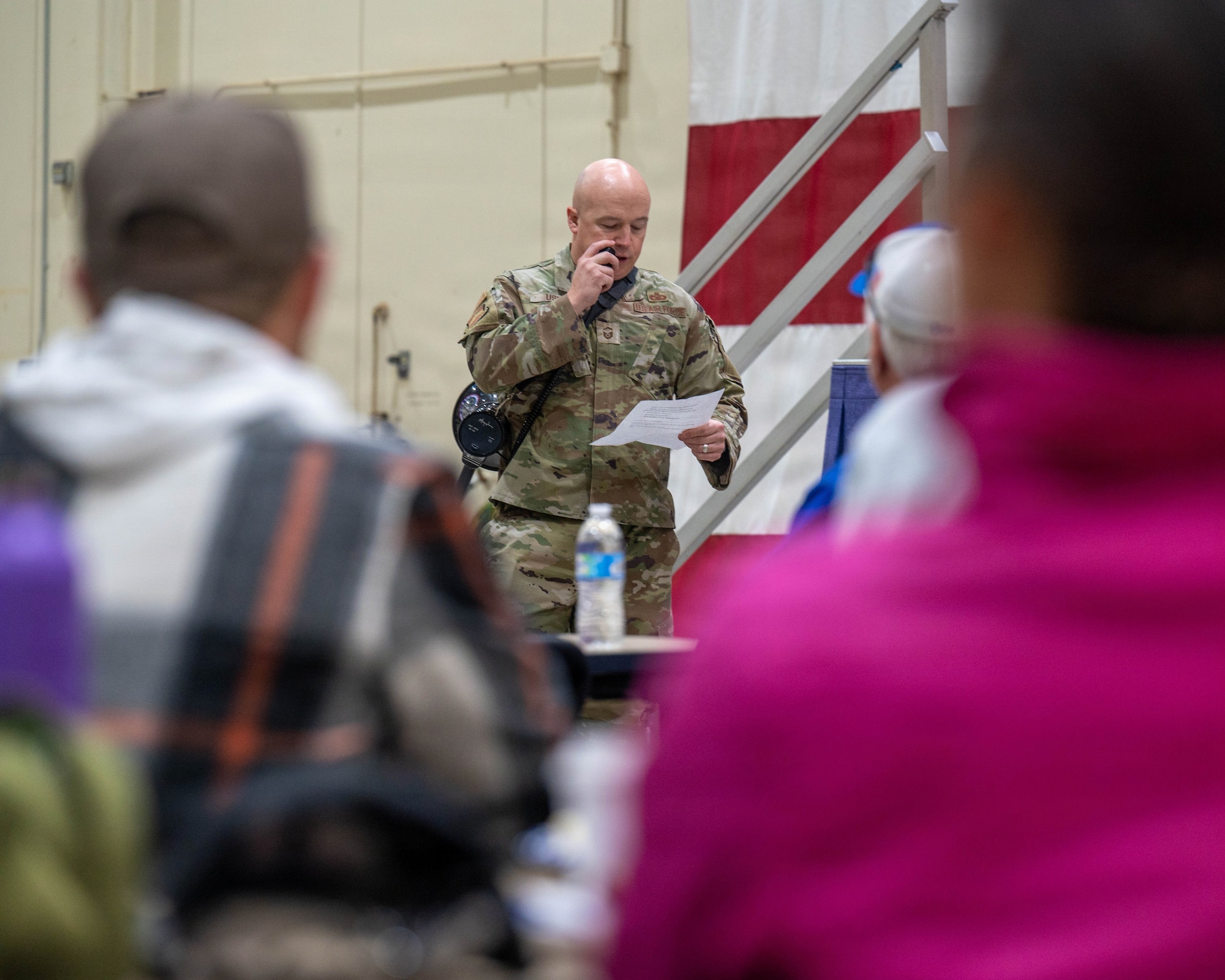 U.S. Air Force Senior Master Sgt. Chad Usher, 56th Public Affairs superintendent, prepares the 56th Fighter Wing honorary commanders for a simulated deployment, Jan. 22, 2026, at the Barry M. Goldwater Range, Arizona. The simulation provided community leaders with a firsthand look at Luke Air Force Base’s mission, people, and daily operations. Their involvement strengthened mutual understanding and built lasting partnerships between the base and the surrounding community. (U.S. Air Force photo by Airman 1st Class Tekorey Watkins)
