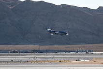 An F-16 Fighting Falcon takes off from the runway at Nellis Air Force Base.