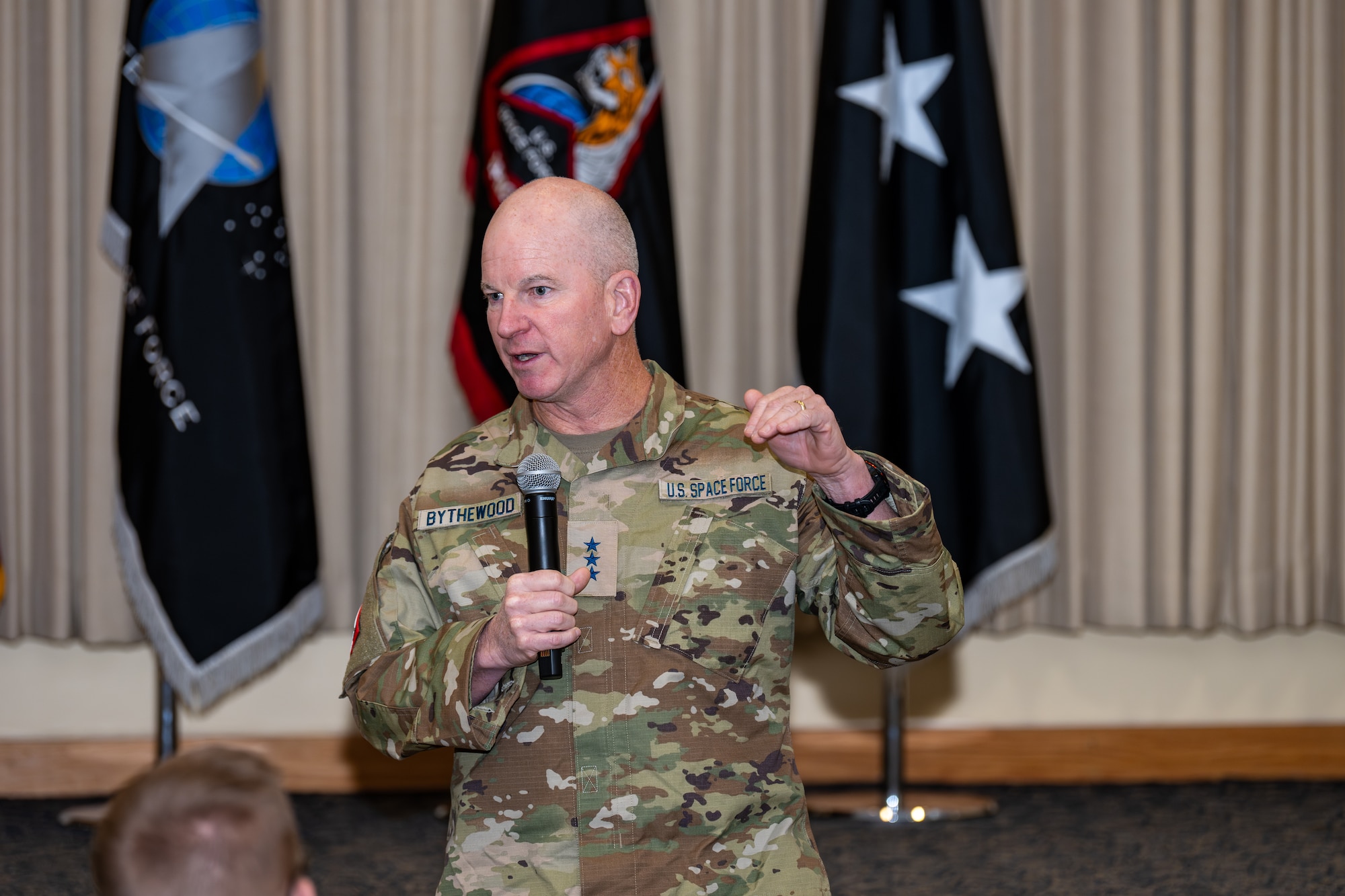Man speaks in front of audience