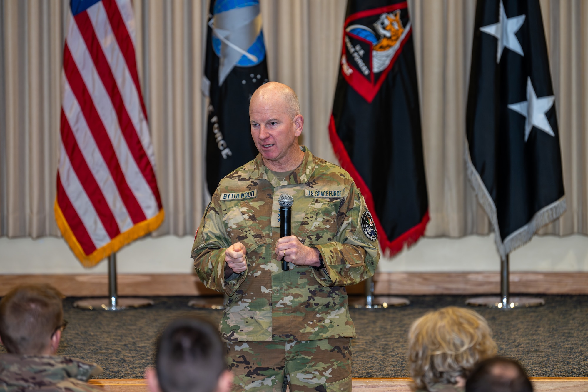 Man speaks in front of audience
