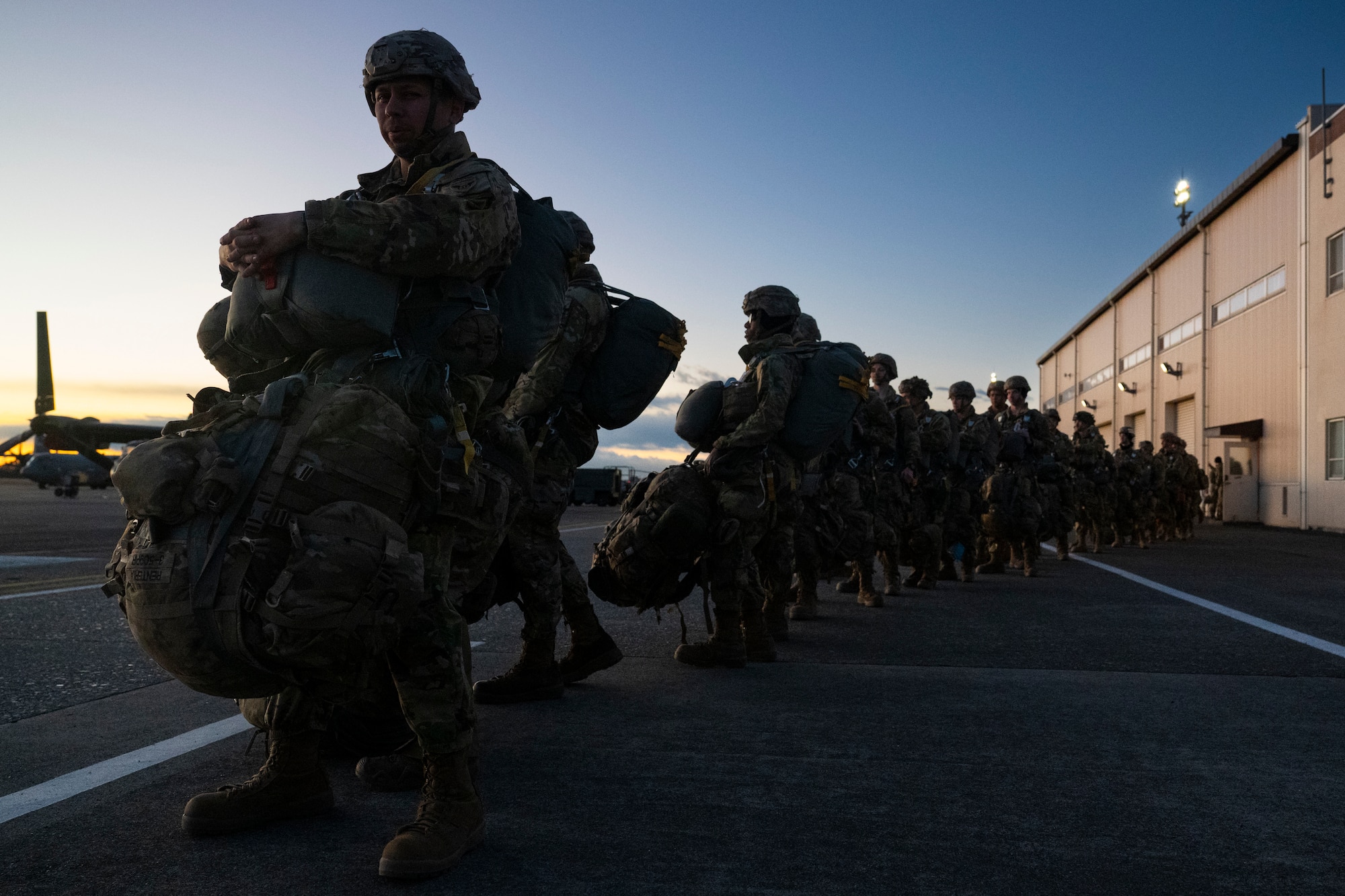 U.S. Army paratroopers assigned to the 11th Airborne Division, 2nd Brigade, prepare to load onto a C-130J Super Hercules assigned to the 36th Airlift Squadron during exercise North Wind 26.