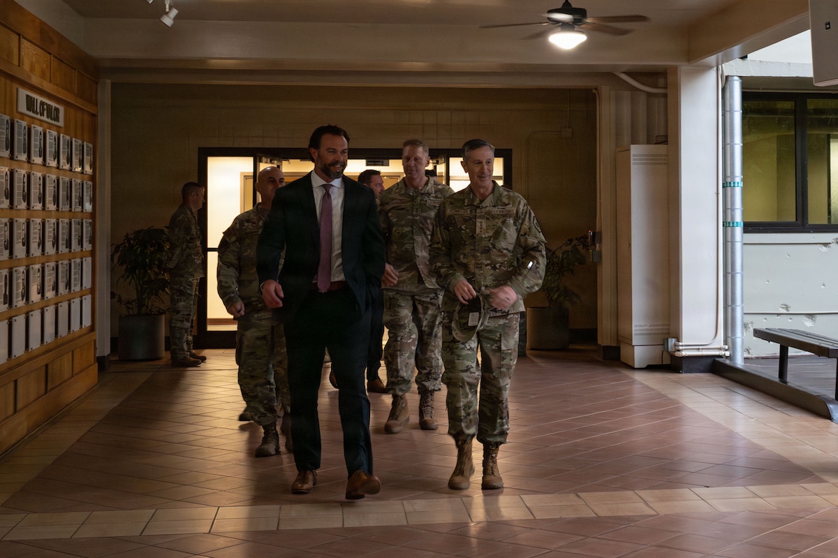 Under Secretary of the Air Force Matt Lohmeier walks with Gen. Kevin Schneider, Pacific Air Forces commander