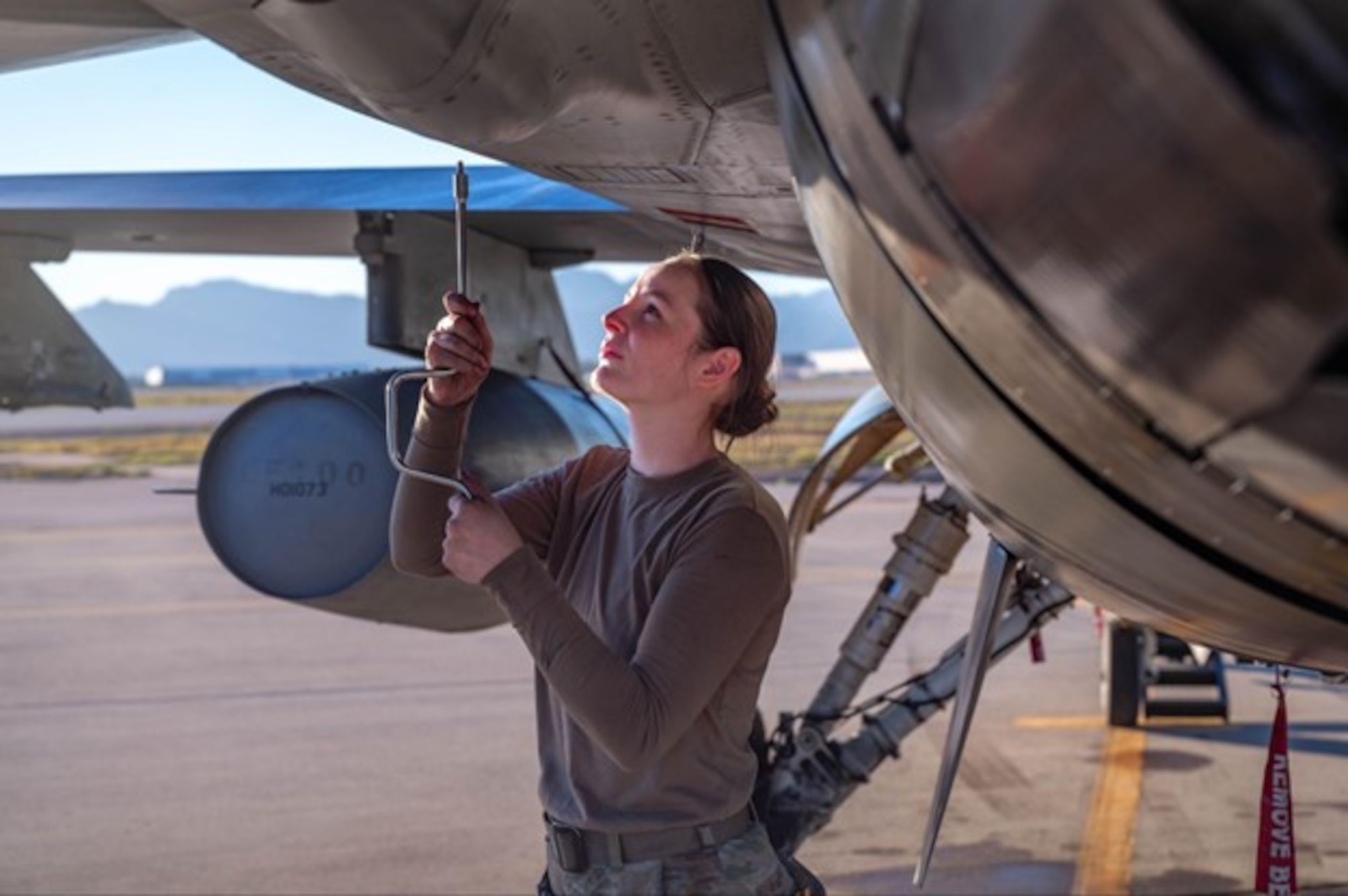 U.S. Airman 1st Class Hannah Patterson-Patton, 314 Aircraft Maintenance Unit crew chief, does maintenance on a F-16 after a joint training exercise, Jan. 27, 2026, at Luke Air Force Base, Arizona. Success in the air relies on coordinated efforts on the ground. Maintenance Airmen from both bases work side by side to keep aircraft mission-ready, executing inspections, repairs and turnarounds under demanding timelines. Weapons crews safely and efficiently configure aircraft with the required munitions, ensuring each sortie launches fully capable.