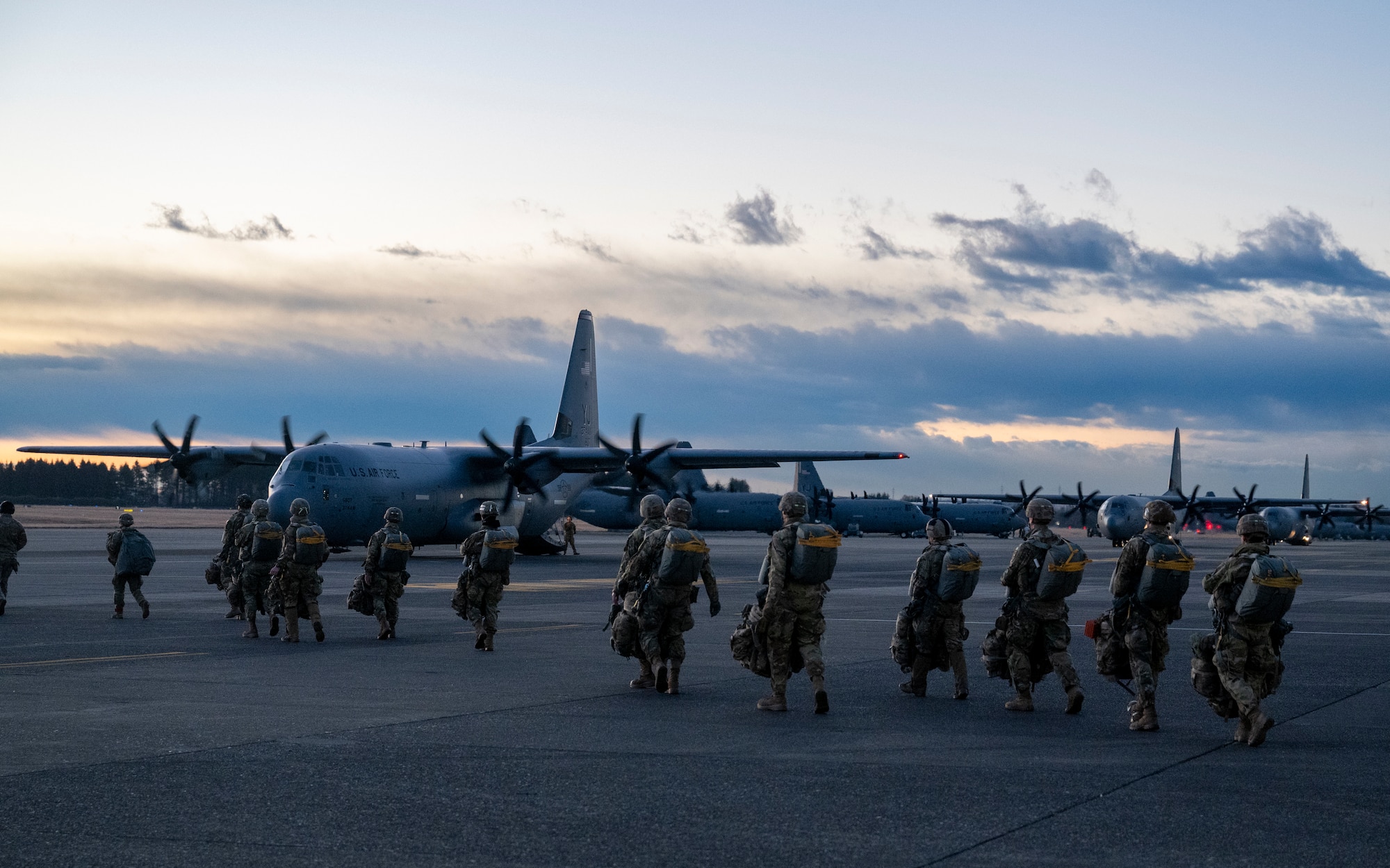 U.S. Army paratroopers assigned to the 11th Airborne Division, 2nd Brigade, prepare to load onto a C-130J Super Hercules assigned to the 36th Airlift Squadron during exercise North Wind 26.