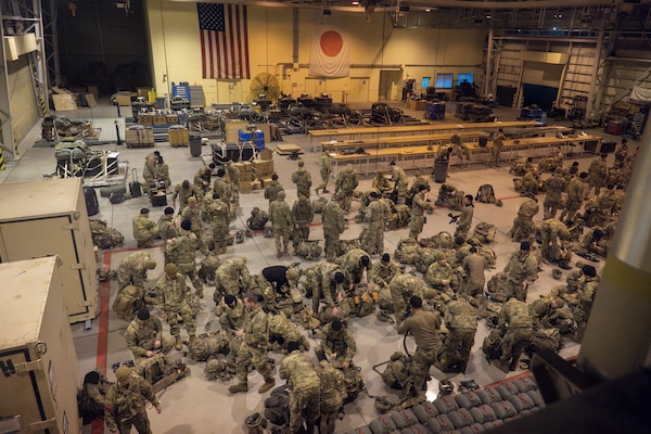 U.S. Army paratroopers assigned to the 11th Airborne Division, 2nd Brigade, prepare to rig equipment during exercise North Wind 26.
