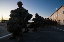 U.S. Army paratroopers assigned to the 11th Airborne Division, 2nd Brigade, prepare to load onto a C-130J Super Hercules assigned to the 36th Airlift Squadron during exercise North Wind 26.