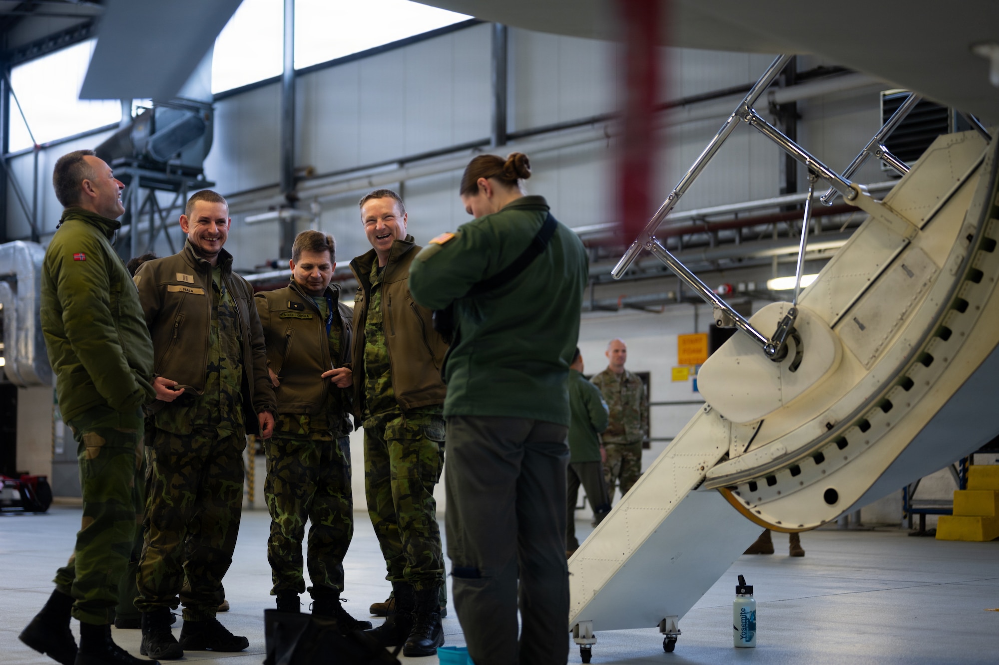 Royal Norwegian Air Force airmen receive a tour of a U.S. Air Force EA-37B Compass Call assigned to the 55th Electronic Combat Group, Davis-Monthan Air Force Base, Arizona, at Ramstein Air Base, Germany, Jan. 26, 2026. The EA-37B visited Ramstein as part of a road show to familiarize Airmen, units and NATO Allies in the U.S. Air Forces in Europe area of responsibility with the new platform and its capabilities. (U.S. Air Force photo by Senior Airman Edgar Grimaldo)