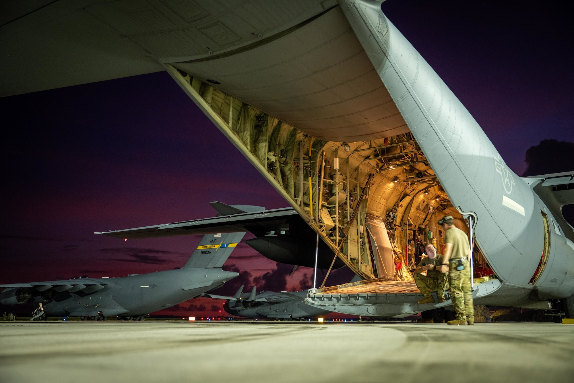 A U.S. Air Force C-130J Super Hercules undergoes preflight checks during Exercise Palmetto Reach at Saipan International Airport, Saipan, Jan. 17, 2026. Participation in Palmetto Reach reinforced the 317th AW’s ability to project airpower, sustain operations across vast distances and integrate seamlessly with mission partners. . (U.S. Air Force photo by Airman 1st Class Adrien Tran)