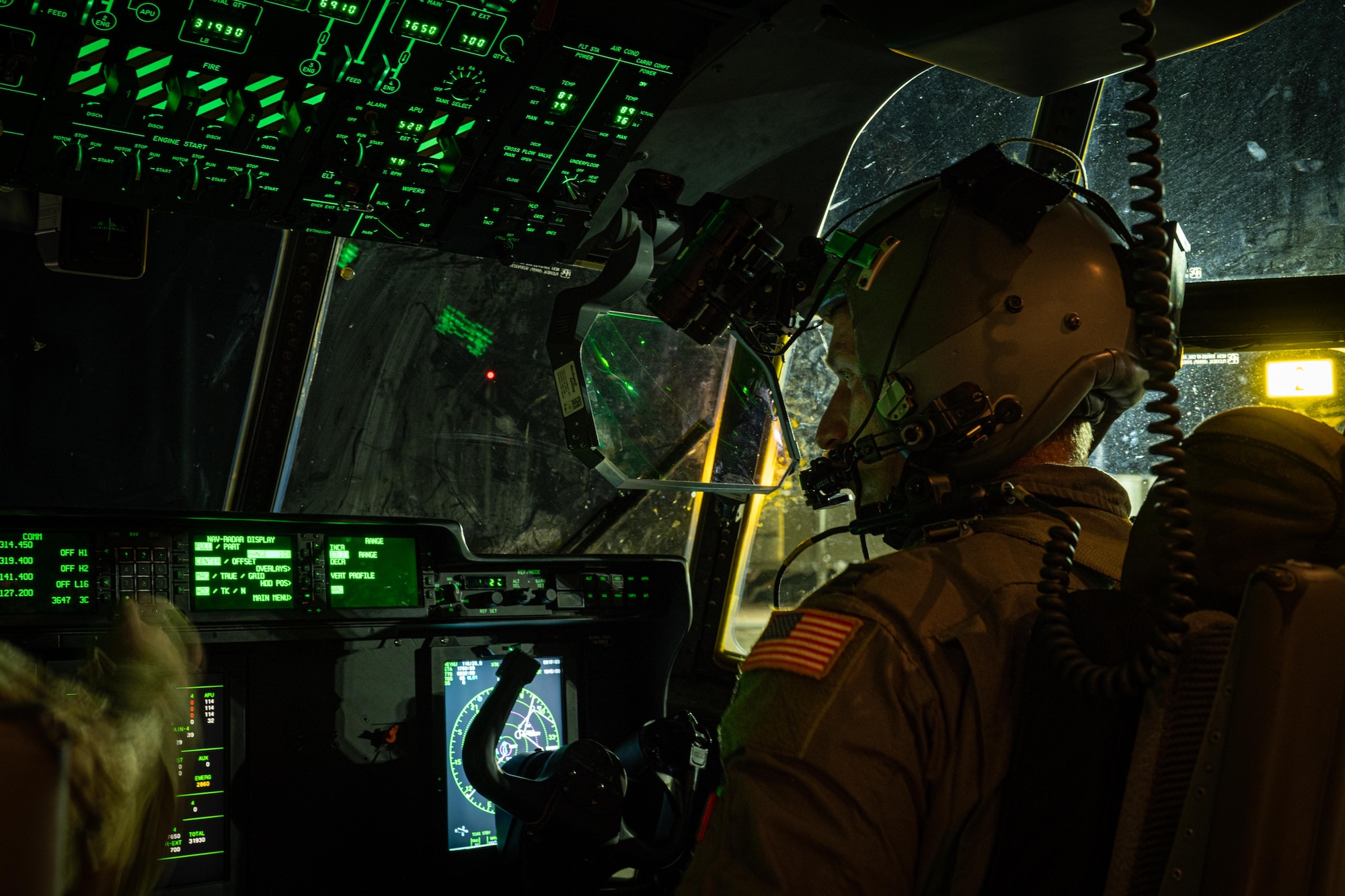 U.S. Air Force Capt. Eric Williams, 317th Operational Support Squadron deputy chief of wing training and C-130J pilot, prepares to fly with night vision goggles during Exercise Palmetto Reach at Saipan International Airport, Saipan, Jan. 17, 2026. The exercise reinforced the 317th Airlift Wing’s role in maintaining a ready, responsive airlift force capable of delivering effects at the speed and scale required in today’s strategic environment. (U.S. Air Force photo by Airman 1st Class Adrien Tran)