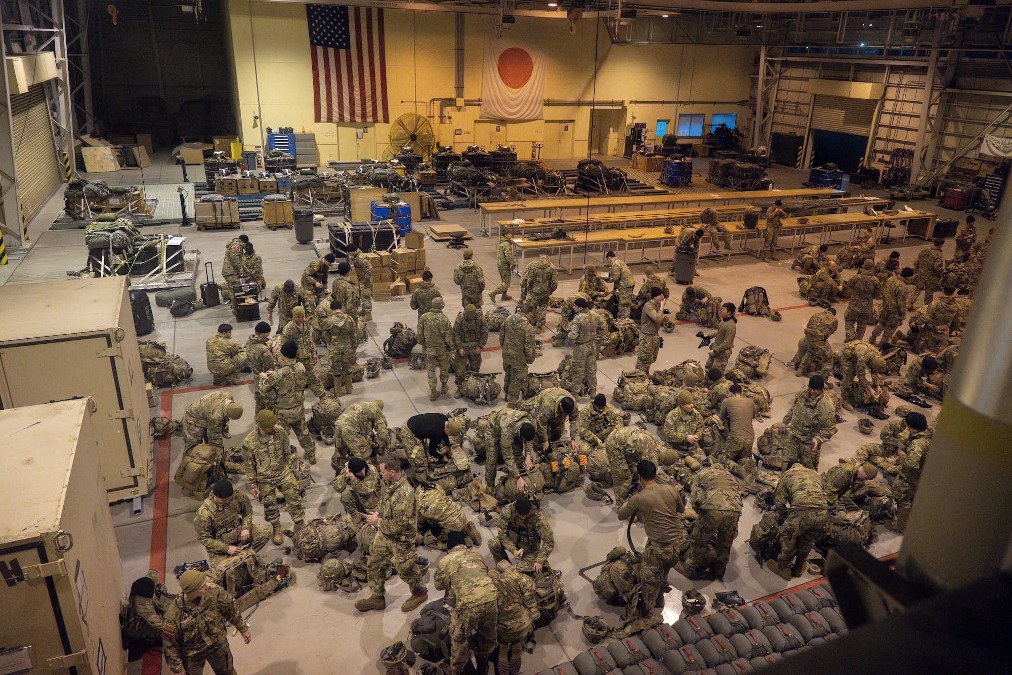 U.S. Army paratroopers assigned to the 11th Airborne Division, 2nd Brigade, prepare to rig equipment during exercise North Wind 26.