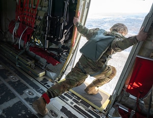A U.S. Army paratrooper assigned to the 11th Airborne Division, 2nd Brigade, conducts a rear check after static line jumps during exercise North Wind 26.