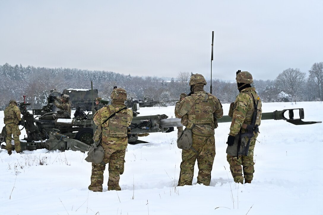 U.S. Paratroopers assigned to 4th Battalion, 319th Field Artillery Regiment, 173rd Airborne Brigade, prepare, load and fire an M777 Howitzer during Dynamic Front 26 at the Grafenwoehr Training Area, Grafenwoehr, Germany, Jan. 27, 2026. Dynamic Front is the practical application of the Eastern Flank Deterrence Line (EFDL) and enhances the U.S. and NATO's ability to coordinate lethal and non-lethal effects in a distributed battlefield. (U.S. Army photo by Pfc. Tomas J. Arce)