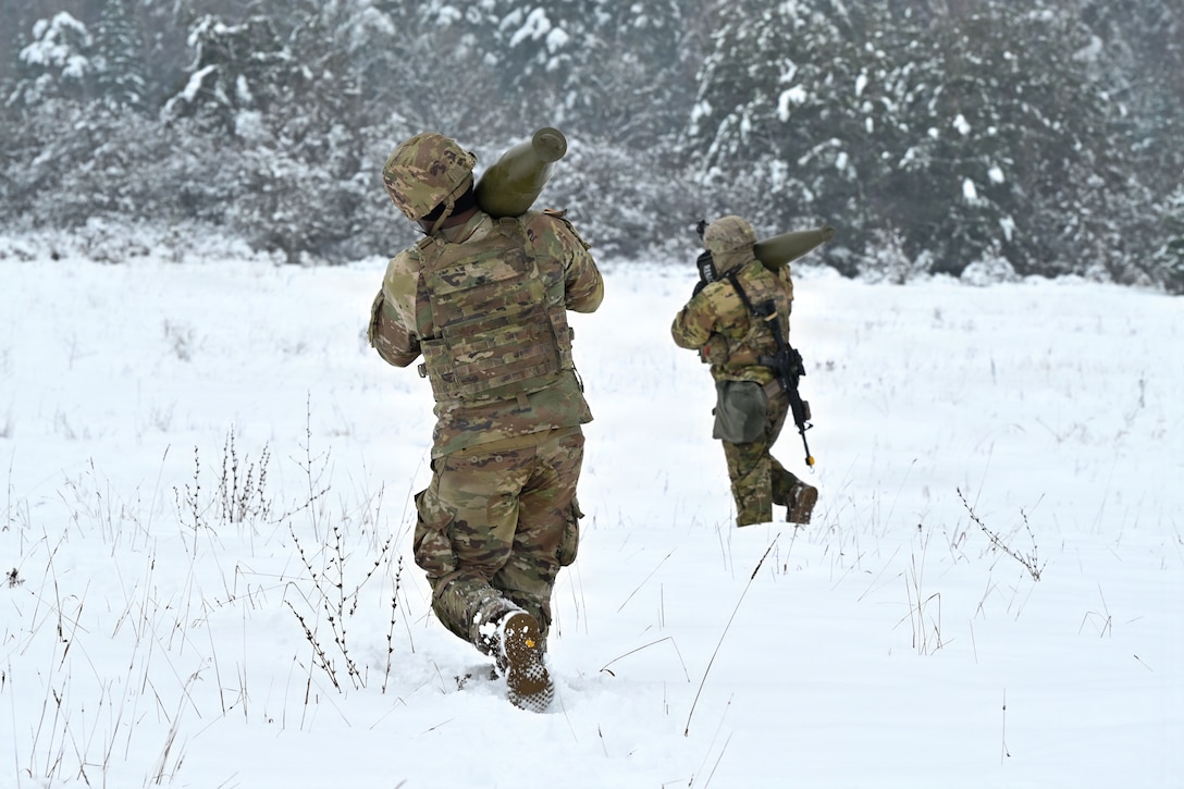 U.S. Paratroopers assigned to 4th Battalion, 319th Field Artillery Regiment, 173rd Airborne Brigade, prepare, load and fire an M777 Howitzer during Dynamic Front 26 at the Grafenwoehr Training Area, Grafenwoehr, Germany, Jan. 27, 2026. Dynamic Front is the practical application of the Eastern Flank Deterrence Line (EFDL) and enhances the U.S. and NATO's ability to coordinate lethal and non-lethal effects in a distributed battlefield. (U.S. Army photo by Pfc. Tomas J. Arce)