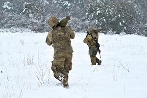 U.S. Paratroopers assigned to 4th Battalion, 319th Field Artillery Regiment, 173rd Airborne Brigade, prepare, load and fire an M777 Howitzer during Dynamic Front 26 at the Grafenwoehr Training Area, Grafenwoehr, Germany, Jan. 27, 2026. Dynamic Front is the practical application of the Eastern Flank Deterrence Line (EFDL) and enhances the U.S. and NATO's ability to coordinate lethal and non-lethal effects in a distributed battlefield. (U.S. Army photo by Pfc. Tomas J. Arce)