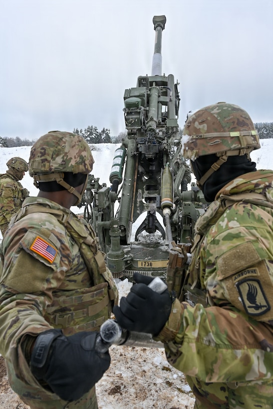 U.S. Paratroopers assigned to 4th Battalion, 319th Field Artillery Regiment, 173rd Airborne Brigade, prepare, load and fire an M777 Howitzer during Dynamic Front 26 at the Grafenwoehr Training Area, Grafenwoehr, Germany, Jan. 27, 2026. Dynamic Front is the practical application of the Eastern Flank Deterrence Line (EFDL) and enhances the U.S. and NATO's ability to coordinate lethal and non-lethal effects in a distributed battlefield. (U.S. Army photo by Pfc. Tomas J. Arce)