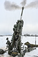 U.S. Paratroopers assigned to 4th Battalion, 319th Field Artillery Regiment, 173rd Airborne Brigade, prepare, load and fire an M777 Howitzer during Dynamic Front 26 at the Grafenwoehr Training Area, Grafenwoehr, Germany, Jan. 27, 2026. Dynamic Front is the practical application of the Eastern Flank Deterrence Line (EFDL) and enhances the U.S. and NATO's ability to coordinate lethal and non-lethal effects in a distributed battlefield. (U.S. Army photo by Pfc. Tomas J. Arce)