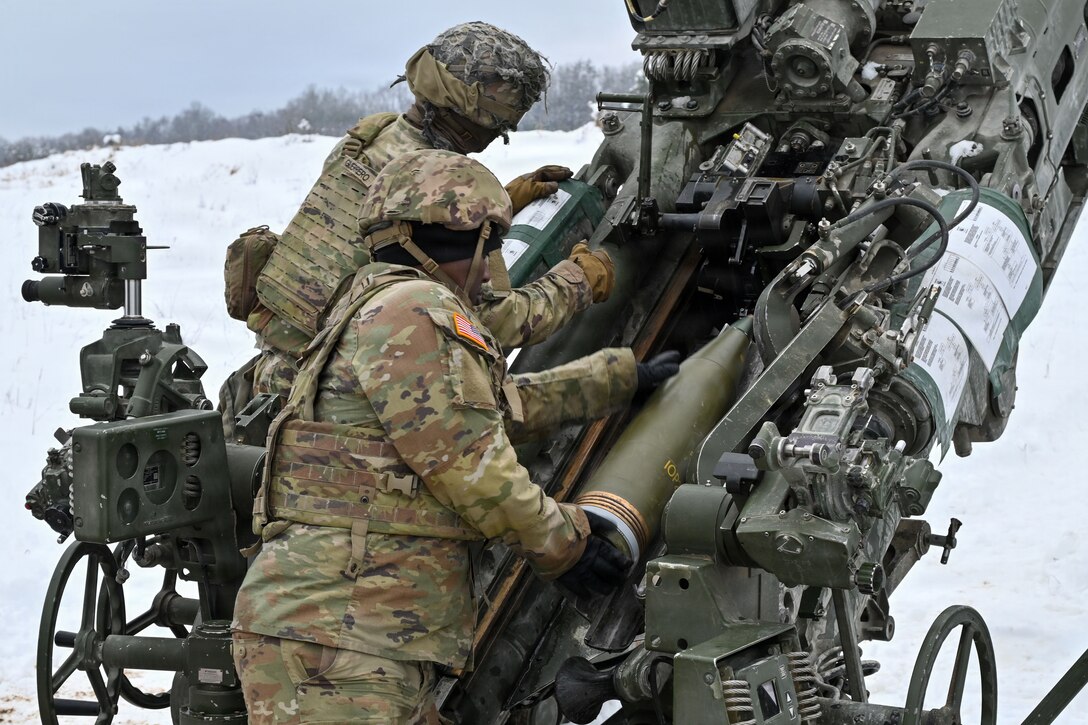 U.S. Paratroopers assigned to 4th Battalion, 319th Field Artillery Regiment, 173rd Airborne Brigade, prepare, load and fire an M777 Howitzer during Dynamic Front 26 at the Grafenwoehr Training Area, Grafenwoehr, Germany, Jan. 27, 2026. Dynamic Front is the practical application of the Eastern Flank Deterrence Line (EFDL) and enhances the U.S. and NATO's ability to coordinate lethal and non-lethal effects in a distributed battlefield. (U.S. Army photo by Pfc. Tomas J. Arce)