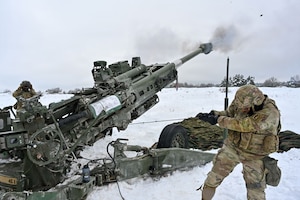 U.S. Paratroopers assigned to 4th Battalion, 319th Field Artillery Regiment, 173rd Airborne Brigade, prepare, load and fire an M777 Howitzer during Dynamic Front 26 at the Grafenwoehr Training Area, Grafenwoehr, Germany, Jan. 27, 2026. Dynamic Front is the practical application of the Eastern Flank Deterrence Line (EFDL) and enhances the U.S. and NATO's ability to coordinate lethal and non-lethal effects in a distributed battlefield. (U.S. Army photo by Pfc. Tomas J. Arce)