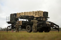 Photo of U.S. Army Sgt. Tamayo Ezekiel (left) and U.S. Army Pfc. Colby McCormick (right)