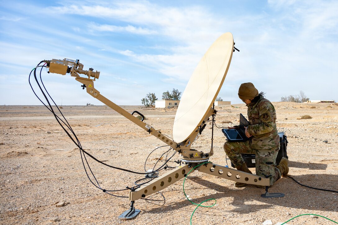 U.S. Air Force Senior Airman Rachel Cajucom, 386th Expeditionary Communications Squadron radio frequency technician, tests an antenna’s connection status during a readiness and dispersal exercise within the U.S. Central Command area of responsibility, Jan. 26, 2026. Training across multiple locations increases adaptability, enabling combat-ready Airmen to operate effectively despite distance, resources, or limited infrastructure. (U.S. Air Force photo by Staff Sgt. Nathan Wingate)