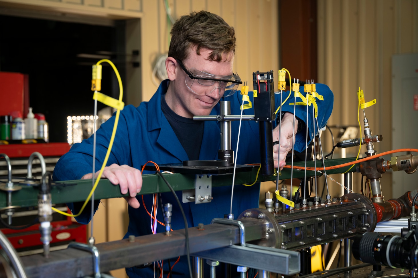Clayton Geipel, Ph.D., U.S. Naval Research Laboratory (NRL) aerospace engineer, adjusts fittings on an optically-accessible solid-fuel slab burner at NRL’s Combustion Lab in Chesapeake Beach, Maryland, Jan. 15, 2026. Researchers and engineers at NRL use an optically-accessible solid-fuel slab burner to perform combustion experiments at conditions relevant to solid-fuel ramjet flight. (U.S. Navy photo by Jonathan Sunderman)