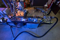 Featured is an optically-accessible solid-fuel slab burner at the U.S. Naval Research Laboratory’s (NRL) Combustion Lab in Chesapeake Beach, Maryland, Jan. 15, 2026. Researchers and engineers at NRL use an optically-accessible solid-fuel slab burner to perform combustion experiments at conditions relevant to solid-fuel ramjet flight. (U.S. Navy photo by Jonathan Sunderman)