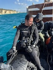 Senior Chief Constructionman Keith Reed, a master diver  assigned to Underwater Construction Team One (UCT 1) Construction Dive Detachment Bravo (CDD/B), prepares to dive in the Sea of Crete Dec. 4, 2025.