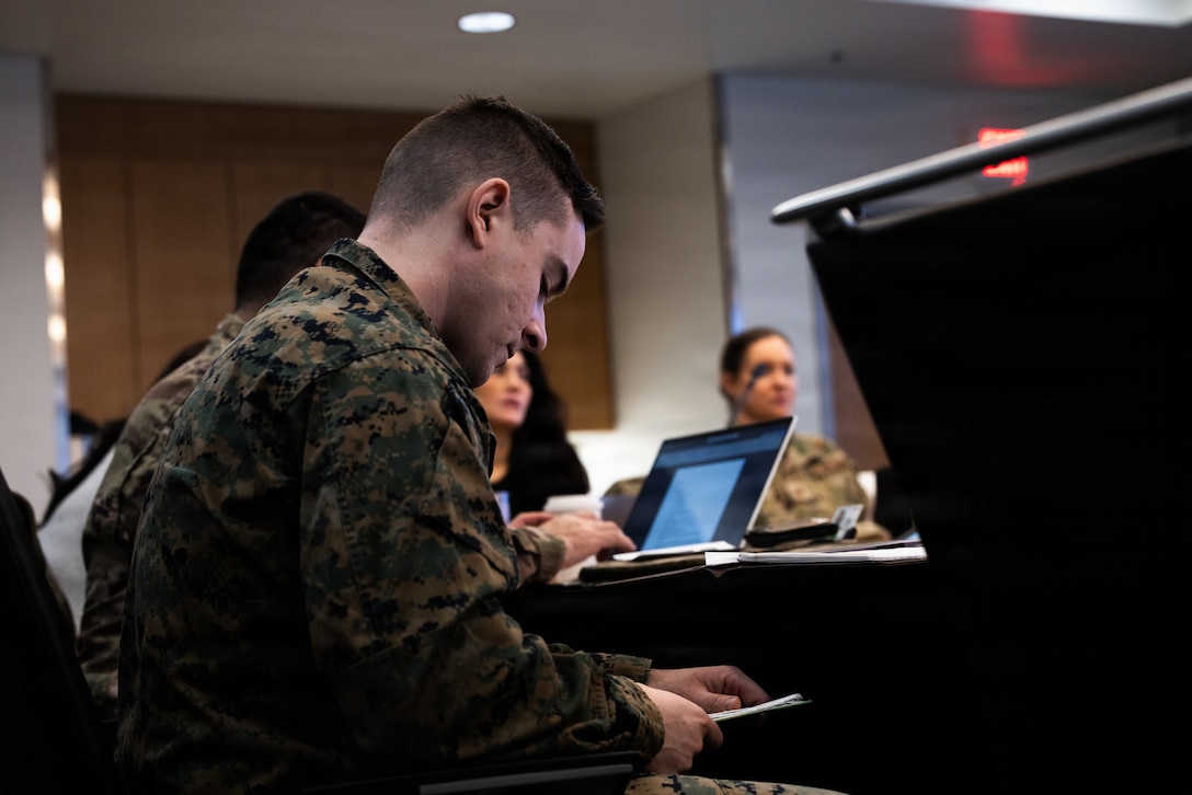 U.S. Marine Corps Capt. Hunter Blake, a civil affairs officer  with 3rd Civil Affairs Group, Marine Forces Reserve, reviews notes at the Kodiak Marketplace in Kodiak, Alaska, Jan. 13, 2026. Kodiak Arctic Care under the Innovative Readiness Training program, partners with the Kodiak Area Native Association to deliver no-cost medical, dental, optometry services to the community across care sites on Alaska's remote Kodiak Island. (U.S. Marine Corps photo by Lance Cpl. Alondra Y. Lopez Gonzalez)