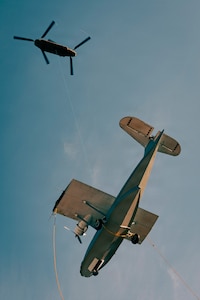 A U.S. Army CH-47 Chinook helicopter assigned to B Company, 1st Battalion, 168th Aviation Regiment, 96th Aviation Troop Command, Washington National Guard, sling loads a PBY-5A Catalina amphibious aircraft from Oak Harbor, Wash., Jan. 21, 2026.