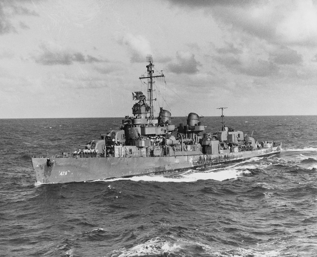 A large ship moves through the ocean.